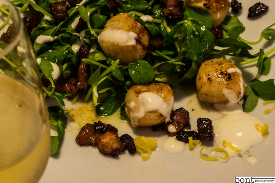 Pan-fried scallops with crisp pancetta, pea shoots and lemon creme fraiche